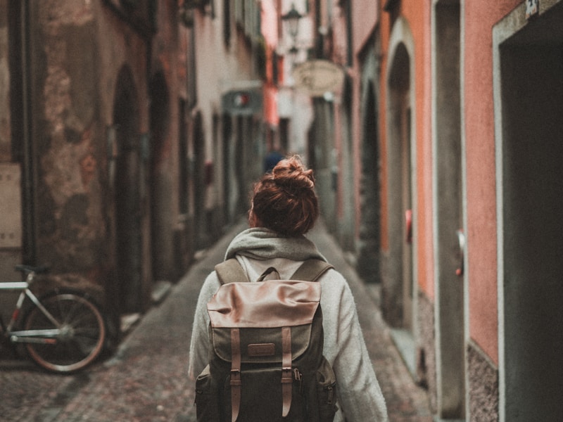 Happy traveller with backpack at airport
