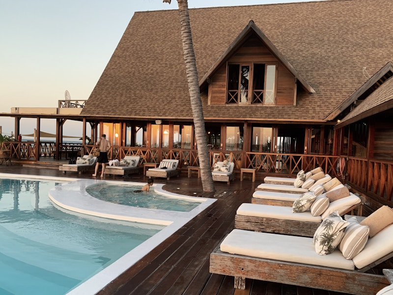 Luxury hotel pool surrounded by palm trees